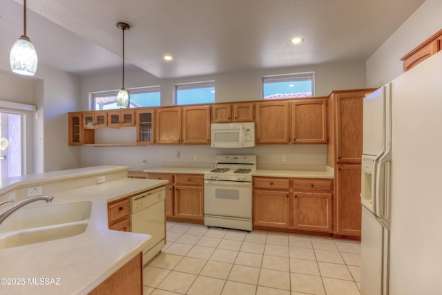 13755 N Buster Spring Way, Oro Valley, AZ 85755 - kitchen featuring white appliances, light countertops, hanging light fixtures, glass insert cabinets, and light tile patterned floors