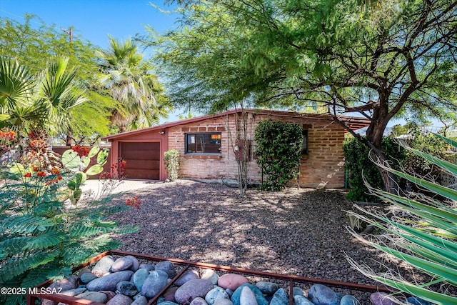 view of outbuilding featuring an attached garage