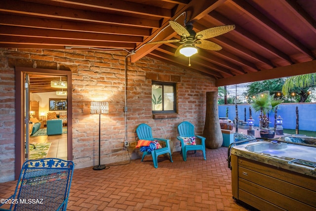 view of patio featuring a hot tub and ceiling fan