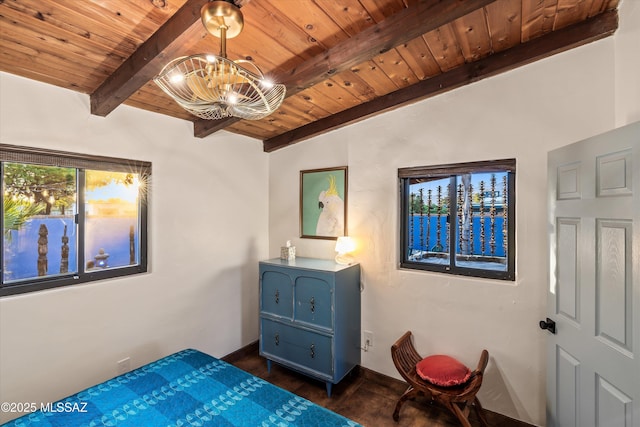 bedroom featuring an inviting chandelier, wood ceiling, baseboards, and dark wood-style flooring