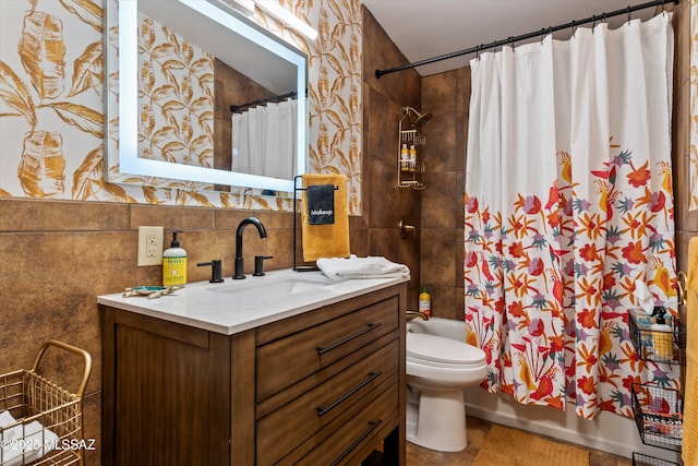 full bathroom with vanity, shower / bath combo, tile walls, toilet, and tasteful backsplash