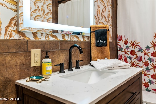 details featuring vanity and backsplash