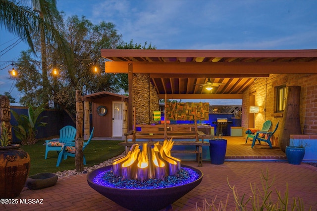 view of patio / terrace featuring an outdoor fire pit