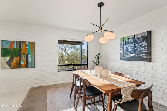 dining area with brick wall