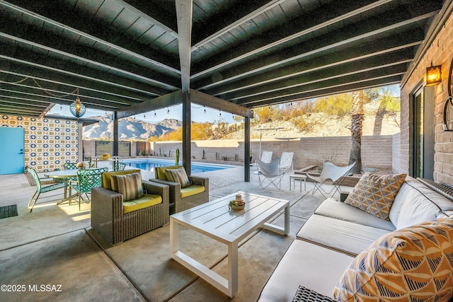 view of patio featuring an outdoor living space, a fenced in pool, and a fenced backyard