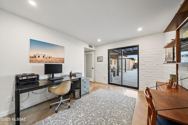 office area with visible vents, recessed lighting, baseboards, and brick wall