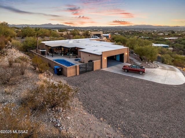 aerial view at dusk with a mountain view