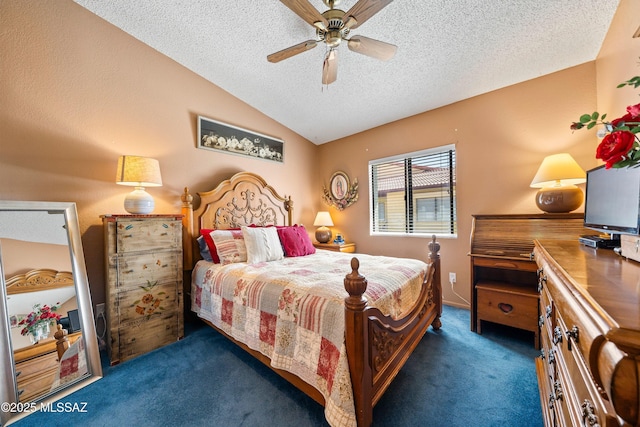 bedroom with vaulted ceiling, carpet floors, a textured ceiling, and a ceiling fan