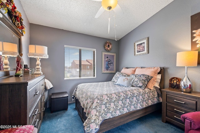 bedroom featuring lofted ceiling, dark colored carpet, ceiling fan, and a textured ceiling