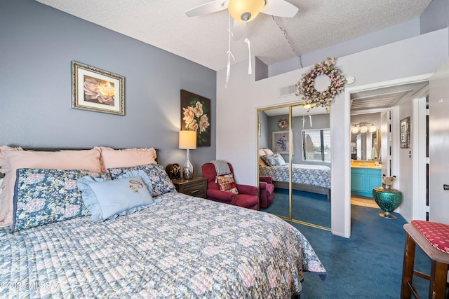 bedroom with visible vents, ceiling fan, a textured ceiling, dark carpet, and a closet