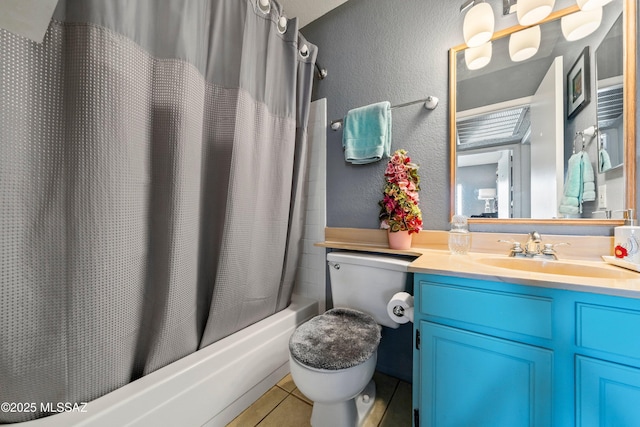 full bathroom with a textured wall, toilet, shower / tub combo, vanity, and tile patterned floors