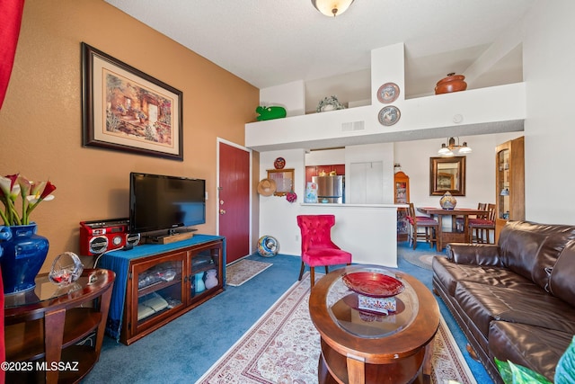 carpeted living area featuring lofted ceiling and visible vents