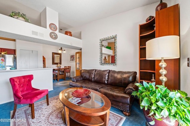 living area with carpet and visible vents