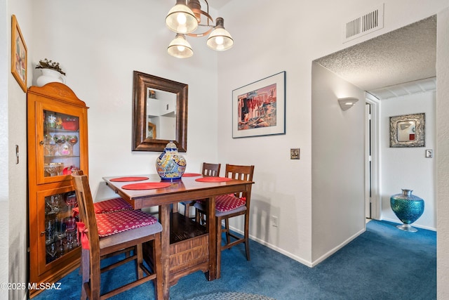 dining area with a chandelier, a textured ceiling, visible vents, baseboards, and carpet