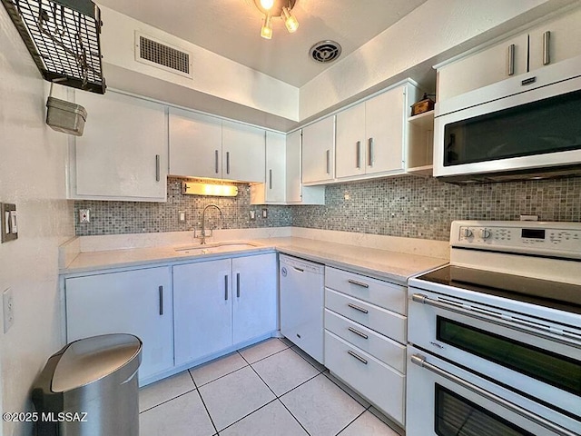 kitchen with range with two ovens, visible vents, light countertops, dishwasher, and open shelves