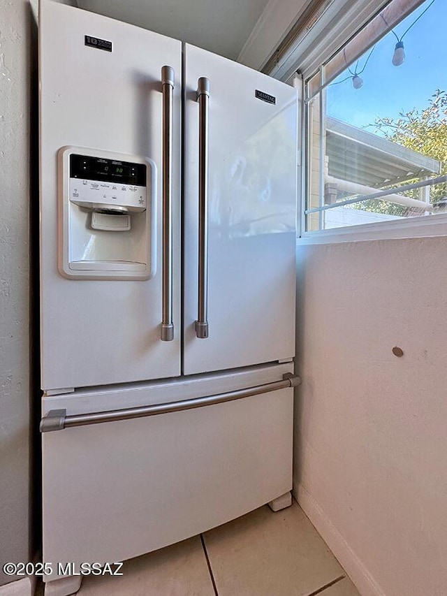 details featuring white refrigerator with ice dispenser