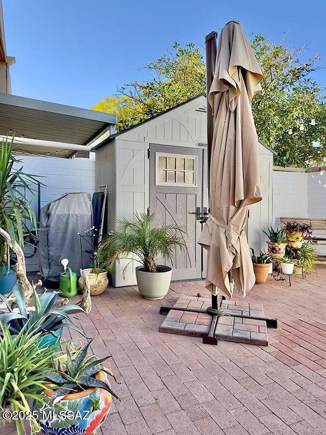 view of shed with fence