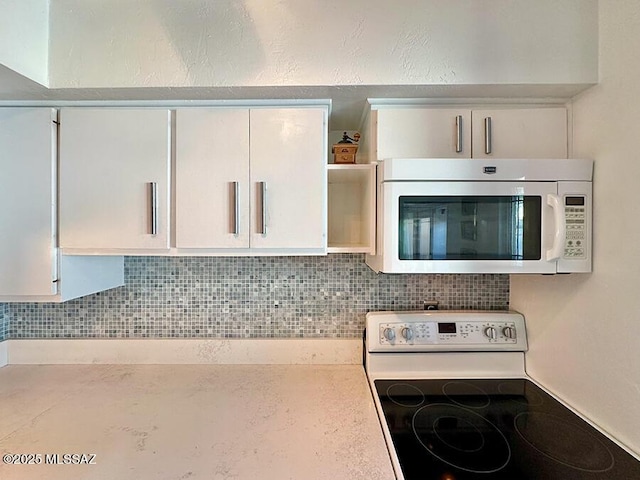 details with open shelves, white appliances, decorative backsplash, and light countertops