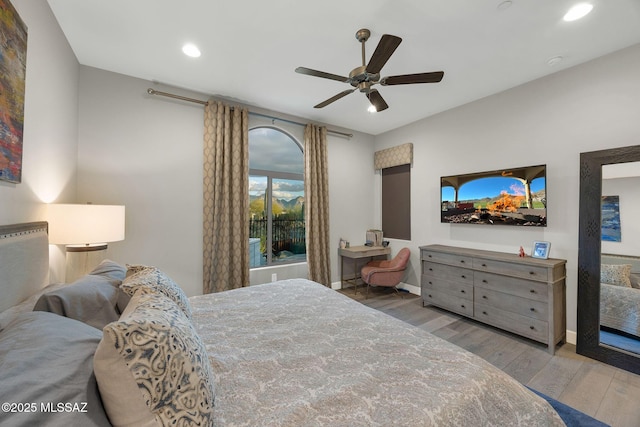 bedroom with ceiling fan, recessed lighting, wood finished floors, and baseboards