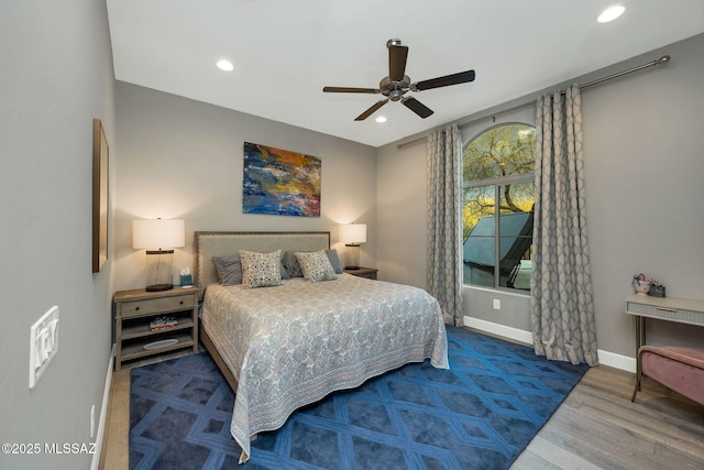 bedroom featuring a ceiling fan, recessed lighting, baseboards, and wood finished floors