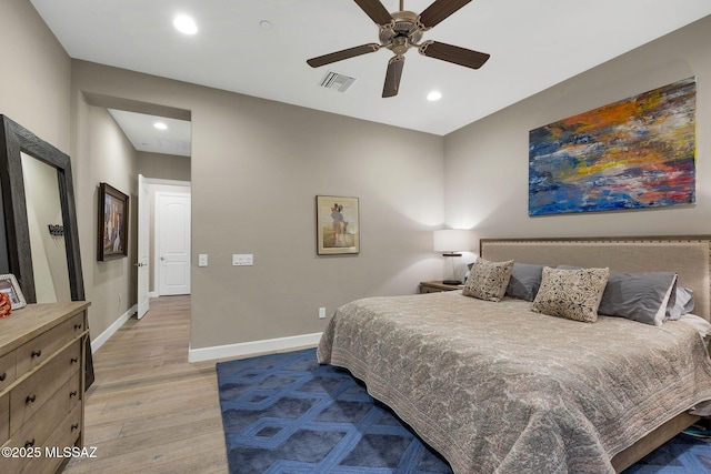 bedroom featuring ceiling fan, recessed lighting, visible vents, baseboards, and light wood-type flooring