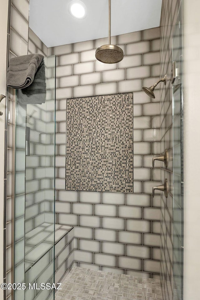 room details with a tile shower