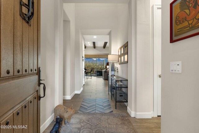 foyer entrance featuring wood finished floors and baseboards