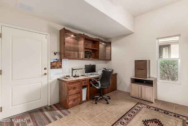 office space with light tile patterned flooring and visible vents