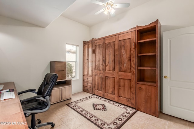 office space with a ceiling fan and light tile patterned floors