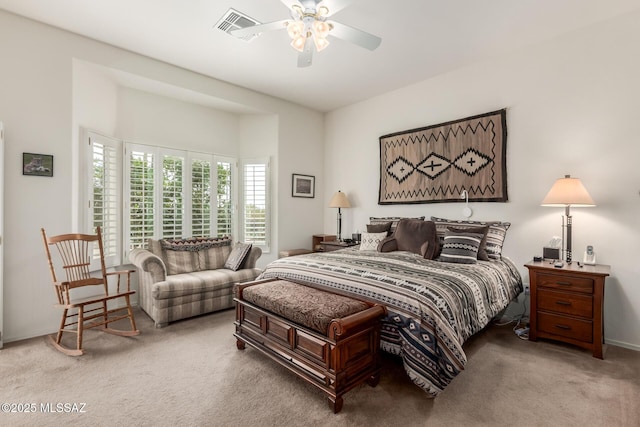 bedroom with baseboards, carpet flooring, visible vents, and a ceiling fan