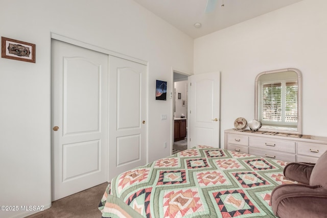 bedroom with carpet and a closet