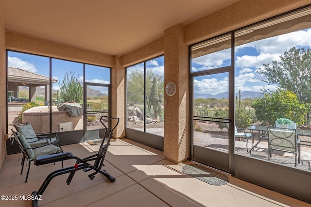 sunroom featuring a mountain view