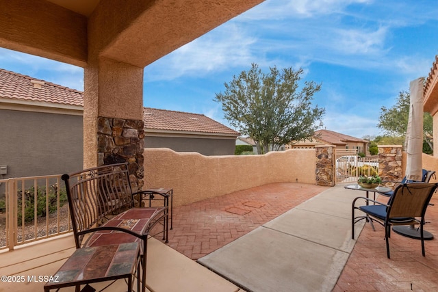 view of patio / terrace featuring a gate