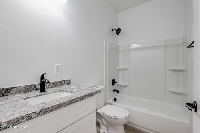 bathroom with toilet, bathtub / shower combination, and vanity