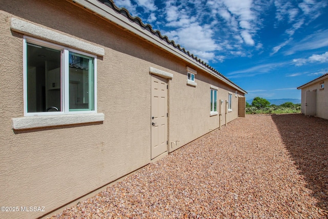 view of property exterior with stucco siding