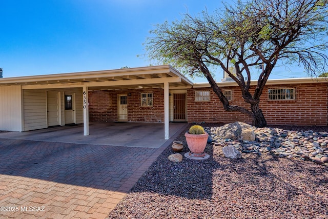 exterior space with brick siding