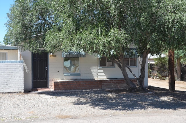 view of front of property featuring brick siding