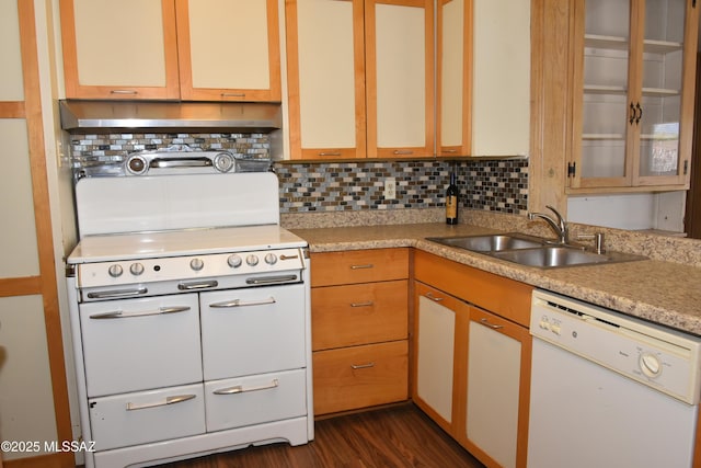 kitchen with white appliances, light countertops, a sink, and backsplash