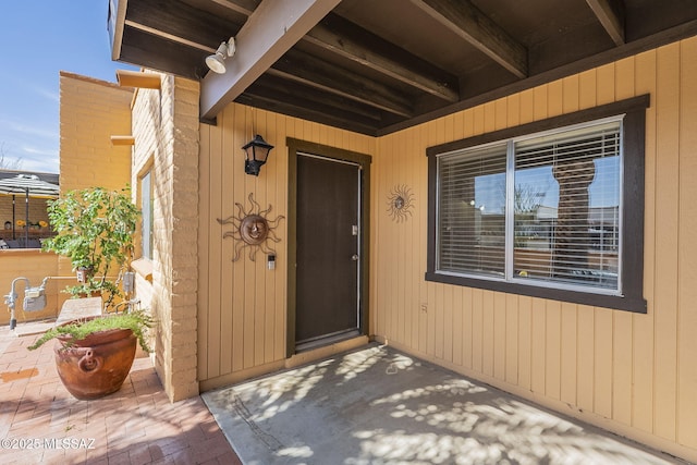 property entrance with a patio area