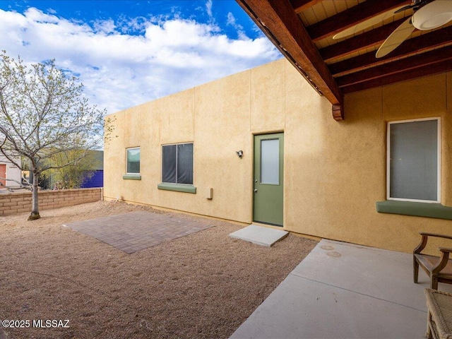 back of house featuring a patio and stucco siding