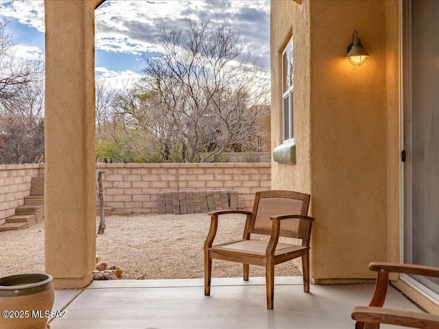 exterior space featuring a patio area and fence