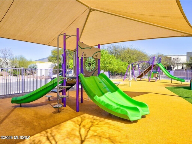 community jungle gym featuring fence