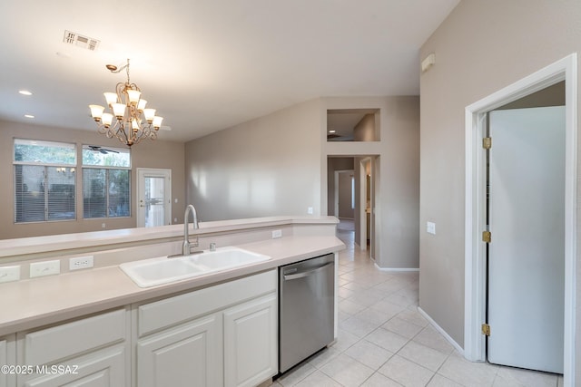 kitchen with light tile patterned floors, a sink, white cabinets, light countertops, and dishwasher