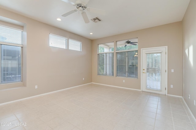 spare room featuring recessed lighting, visible vents, light tile patterned flooring, ceiling fan, and baseboards