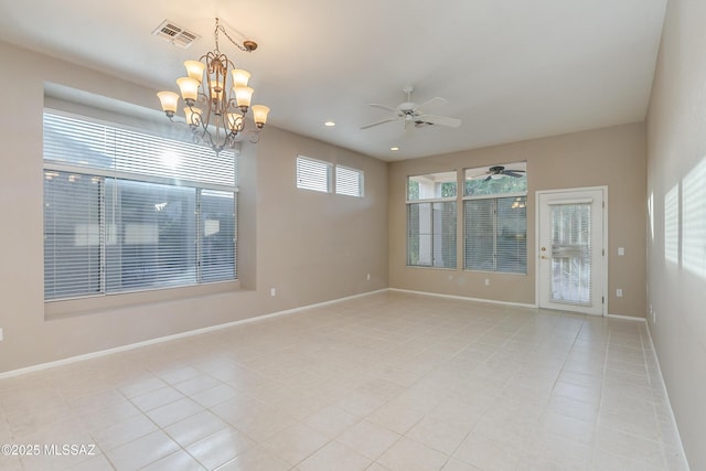 empty room with light tile patterned floors, recessed lighting, visible vents, baseboards, and ceiling fan with notable chandelier