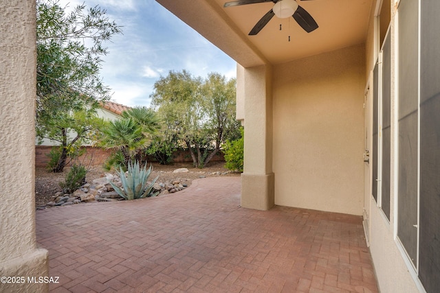 view of patio / terrace with a fenced backyard and ceiling fan