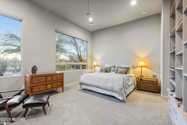 bedroom with baseboards, recessed lighting, visible vents, and light colored carpet