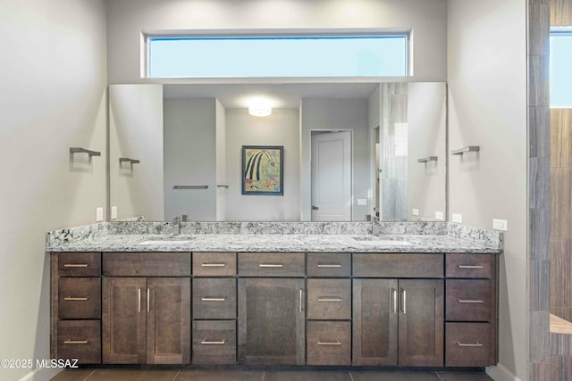 full bath featuring a sink and double vanity