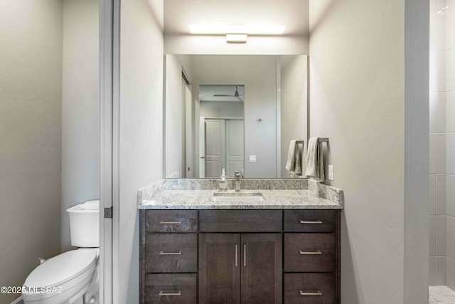 bathroom featuring toilet and vanity