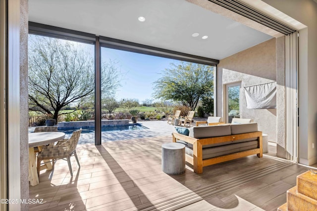 interior space featuring expansive windows, wood finished floors, and recessed lighting